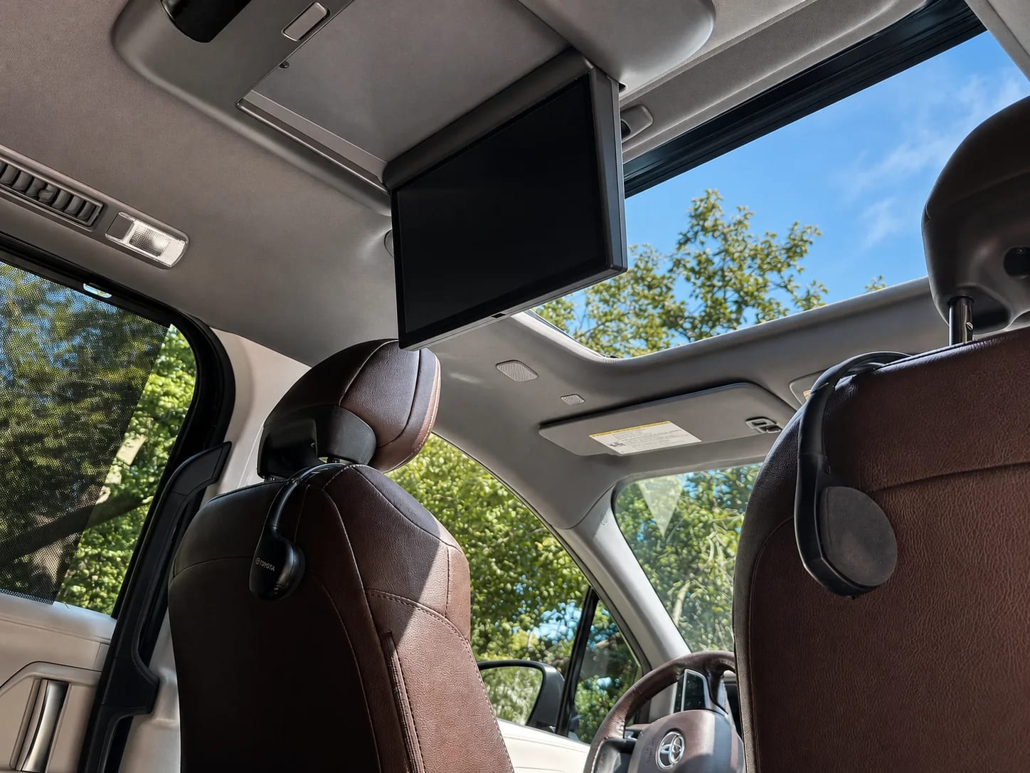 Rear entertainment screen and open moonroof in the Toyota Sienna